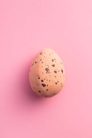 Colorful chocolate easter eggs. Sweet candy eggs on a pink background. Top view.の写真素材