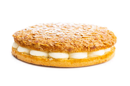 Sweet almond cake. Pie with cream and almonds isolated on white background.の写真素材