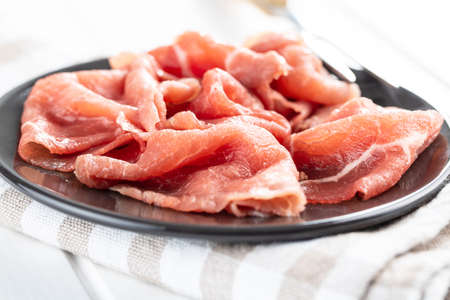 Sliced carpaccio. Raw beef meat on plate.の写真素材