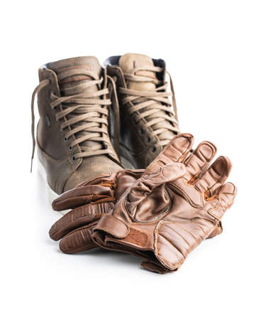 Safety motorcycle accessories. Leather gloves and shoes isolated on white background.