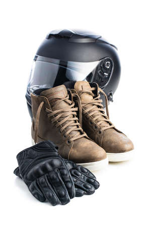 Safety motorcycle accessories. Leather gloves, helmet and shoes isolated on white background.の写真素材