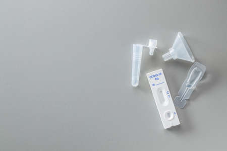 rapid antigen test. Rapid antibodies test kit on gray background. Top view.