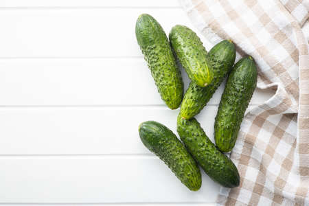 Fresh green cucumbers on white table.の写真素材