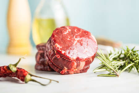 The raw beef meat steak on white table.の写真素材