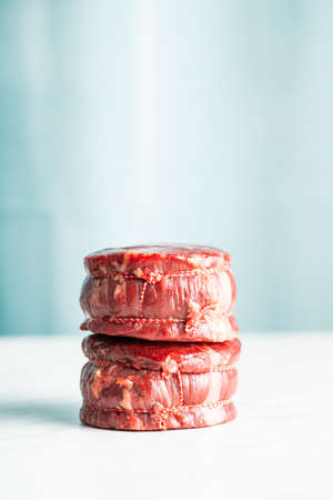 The raw beef meat steak on white table.の写真素材