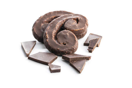 Sweet pastry palmeritas with chocolate icing isolated on white background.