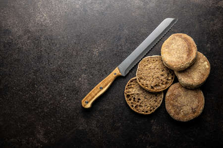 Toast bread buns on black table. Top view.の素材 [FY310169235268]