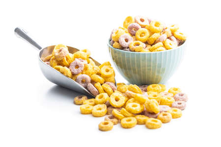 Colorful cereal rings in scoop isolated on white background.