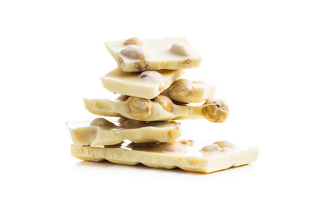 White nutty chocolate with hazelnuts isolated on white background.の写真素材