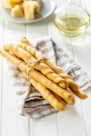 Grissini sticks. Traditional italian bread sticks on white table.の写真素材