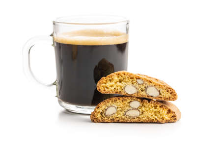 Italian cantuccini cookies and coffee cup. Sweet dried biscuits with almonds isolated on white background.の写真素材