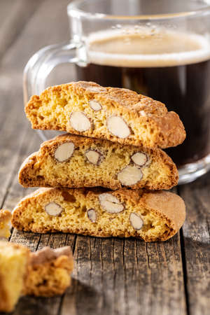 Italian cantuccini cookies. Sweet dried biscuits with almonds on wooden table.の写真素材