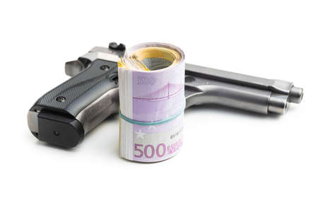 Hand gun and euro banknotes isolated on white background.の写真素材