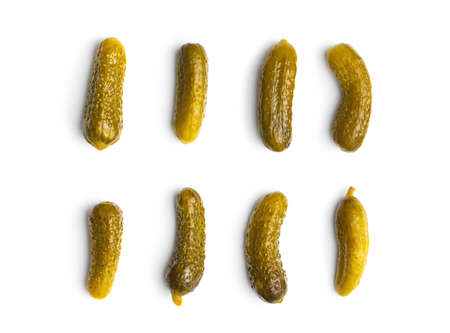Marinated pickles. Canned cucumbers isolated on white background.の写真素材