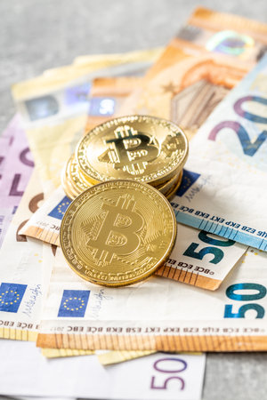 Bitcoins and euro banknotes. Coins of bitcoin.の写真素材