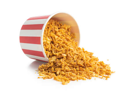 Pieces of fried onions in paper cup isolated on white babckground.の写真素材