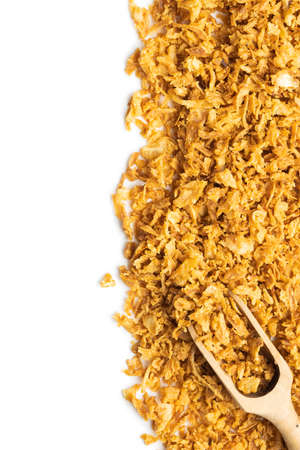 Pieces of fried onions isolated on white background.の写真素材