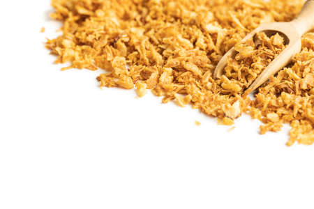 Pieces of fried onions isolated on white background.の写真素材