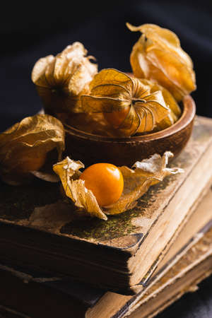 Physalis peruviana. Cape Gooseberry or ground cherries fruit on black table.の写真素材