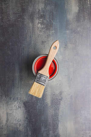 Clean paint brushes and can of color on grunge background. Top view.の写真素材