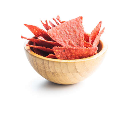 Salted tortilla chips triangle with red beet flavor isolated on white background.の写真素材