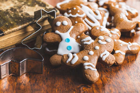 Homemade sweet christmas gingerbread cookies on wooden table.