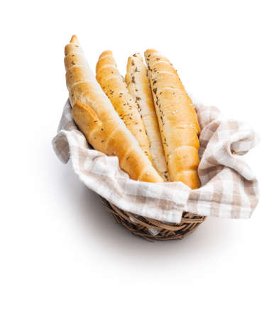 Baked croissant in basket. Crispy bun roll isolated on a white background.の写真素材