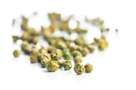 Dried green peppercorn. Dry green pepper spice isolated on a white table.の写真素材