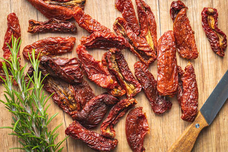 Sun dried tomatoes on wooden table. Top view.の写真素材