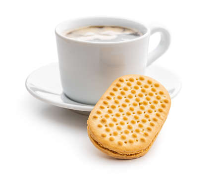 Sweet sandwich cookies and coffee cup. Biscuits with cocoa cream filling isolated on a white background.の写真素材