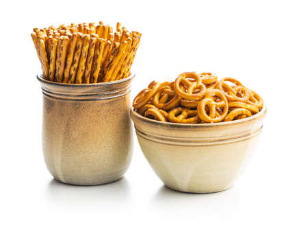 Mini pretzels and salted sticks. Crusty salted snack isolated on a white background.の写真素材