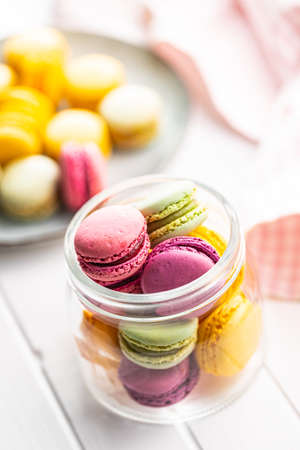Sweet colorful macarons. Traditional french macaroons. Tasty dessert in the jar.の写真素材