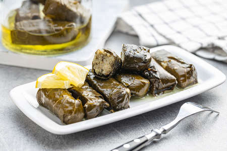 Dolmades. Stuffed vine leaves. Greek appetizer on the plate.の写真素材