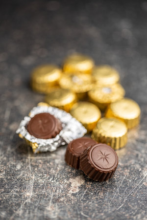 Chocolate pralines. Sweet chocolate candies on a kitchen table.の写真素材