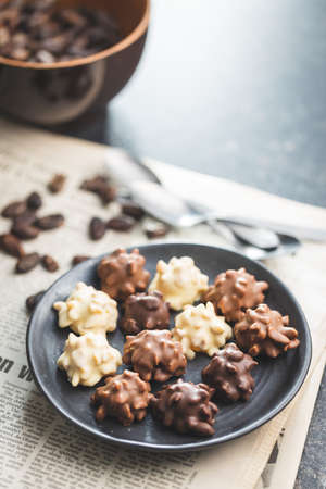Chocolate truffles. Sweet pralines on a plate.