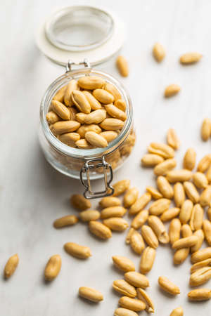 Roasted peeled peanuts in a jar.