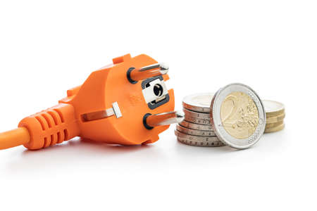 Electric plug and euro coins isolated on the white background. Concept of increasing electricity...
