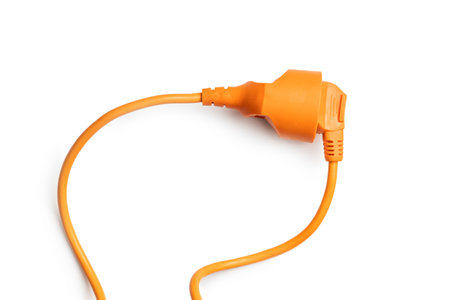 Connected orange electric plug isolated on the white background.の写真素材