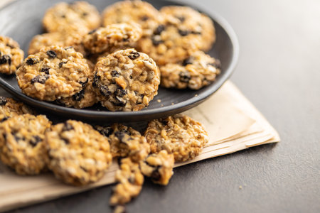 Wholegrain oat cookies. Cookies with oatmeal and raisins on the newspapers.
