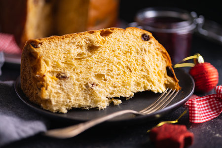 Panettone Christmas Cake. Italian sweet bread on the plate. Top view.