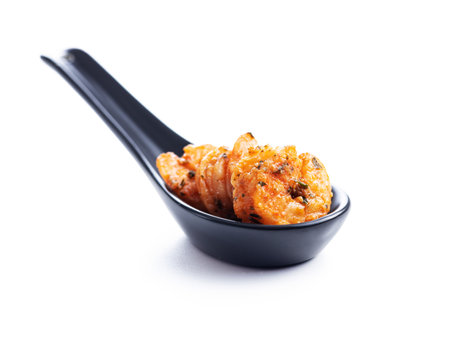 Grilled tiger shrimps in ceramic spoon isolated on the white background.の写真素材