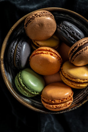 Colorful sweet macaron dessert in bowl. Top view.の写真素材