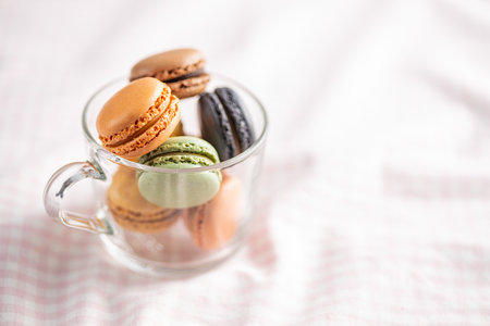 Sweet macaron dessert. Colorful macarons in the cup.の写真素材
