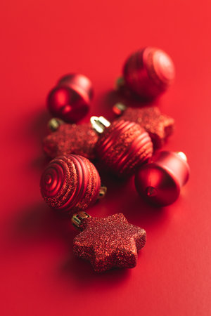 Red christmas decoration. Christmas bulbs on the red background.の写真素材