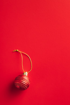 Red christmas decoration. Christmas bulbs on the red background. Top iew.の写真素材