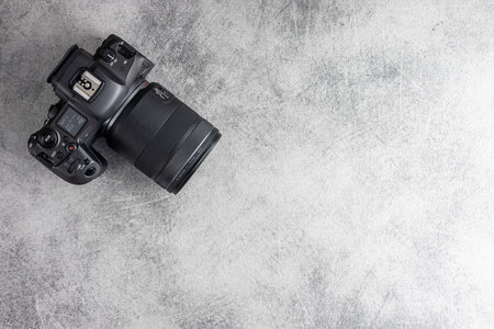 Digital mirrorless camera on the gray table.