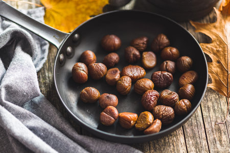 Peeled chestnuts. Sweet roasted chestnuts on the pan.の写真素材