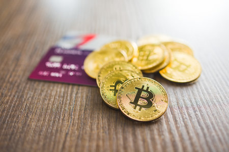 Cryptocurrency. Bitcoin virtual money. Golden coins and the credit cards