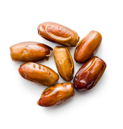 Dried dates fruit isolated on the white background.