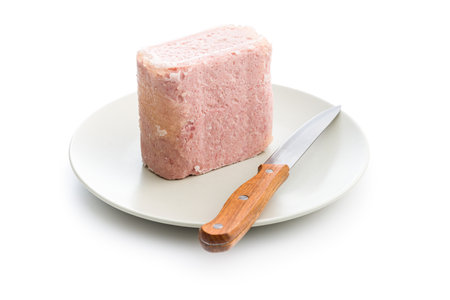 Luncheon meat on plate isolated on the white background.の写真素材